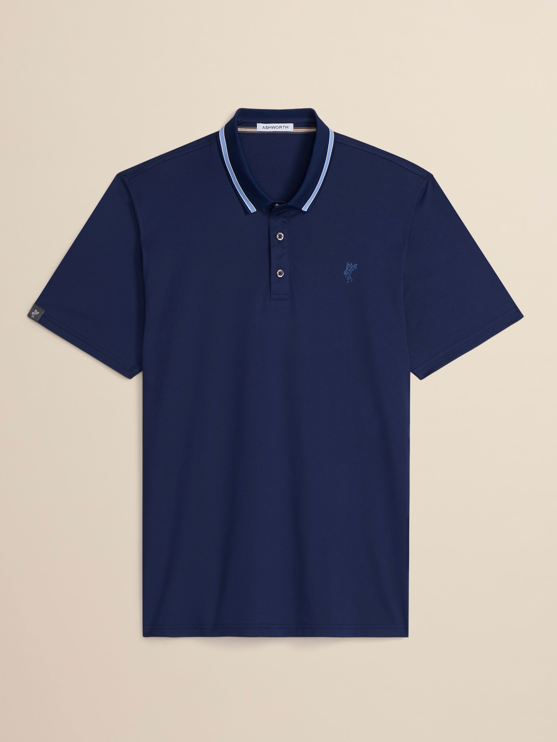 Navy blue polo shirt with white trim on a beige background
