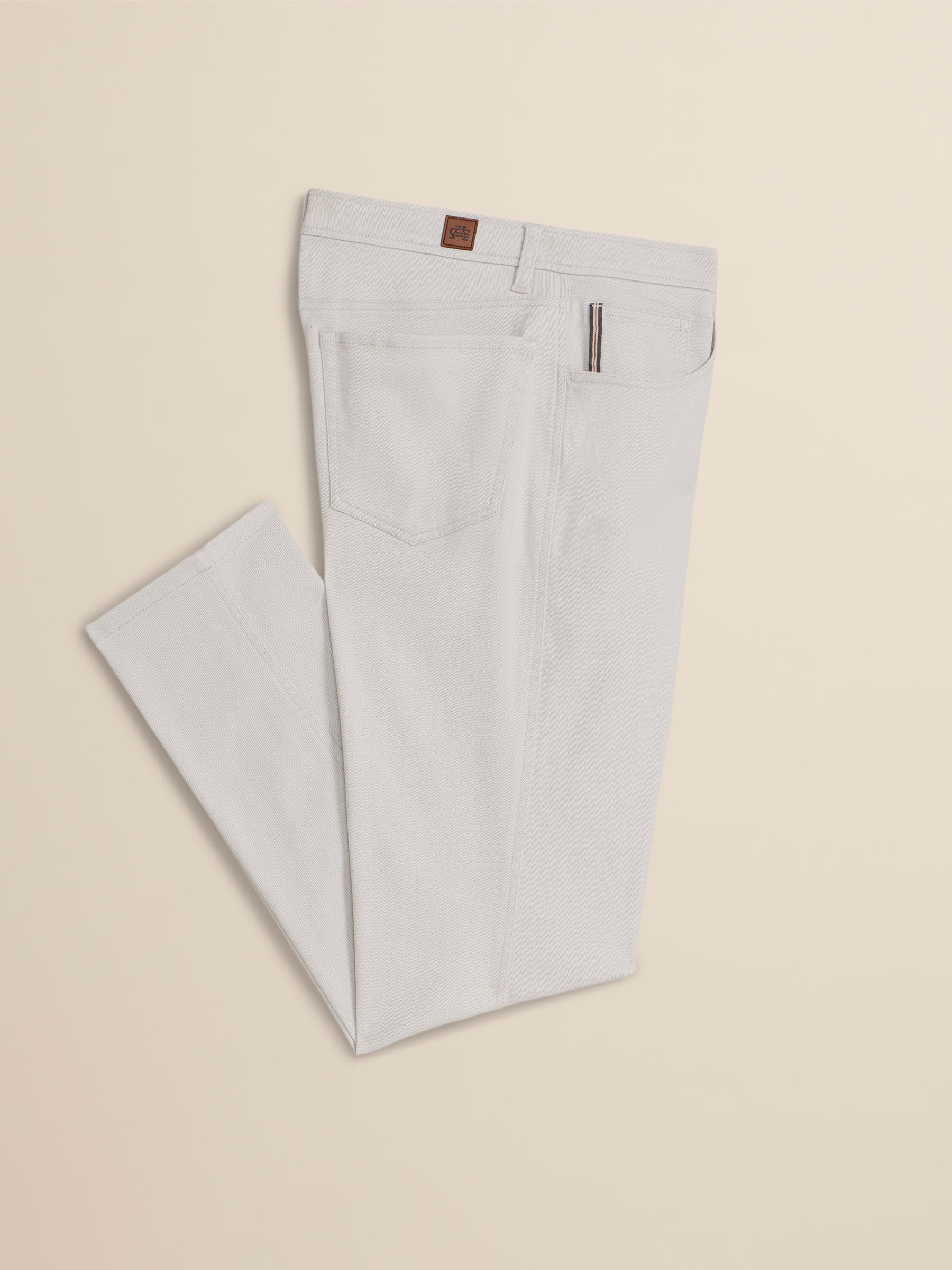 Light gray pants on a beige background